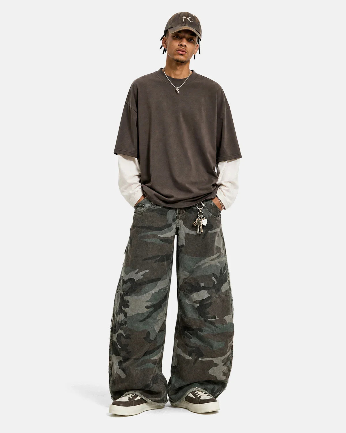 Inflation Streetwear double waist camo cargo pants with multiple pockets and adjustable waistband, stylish streetwear design.