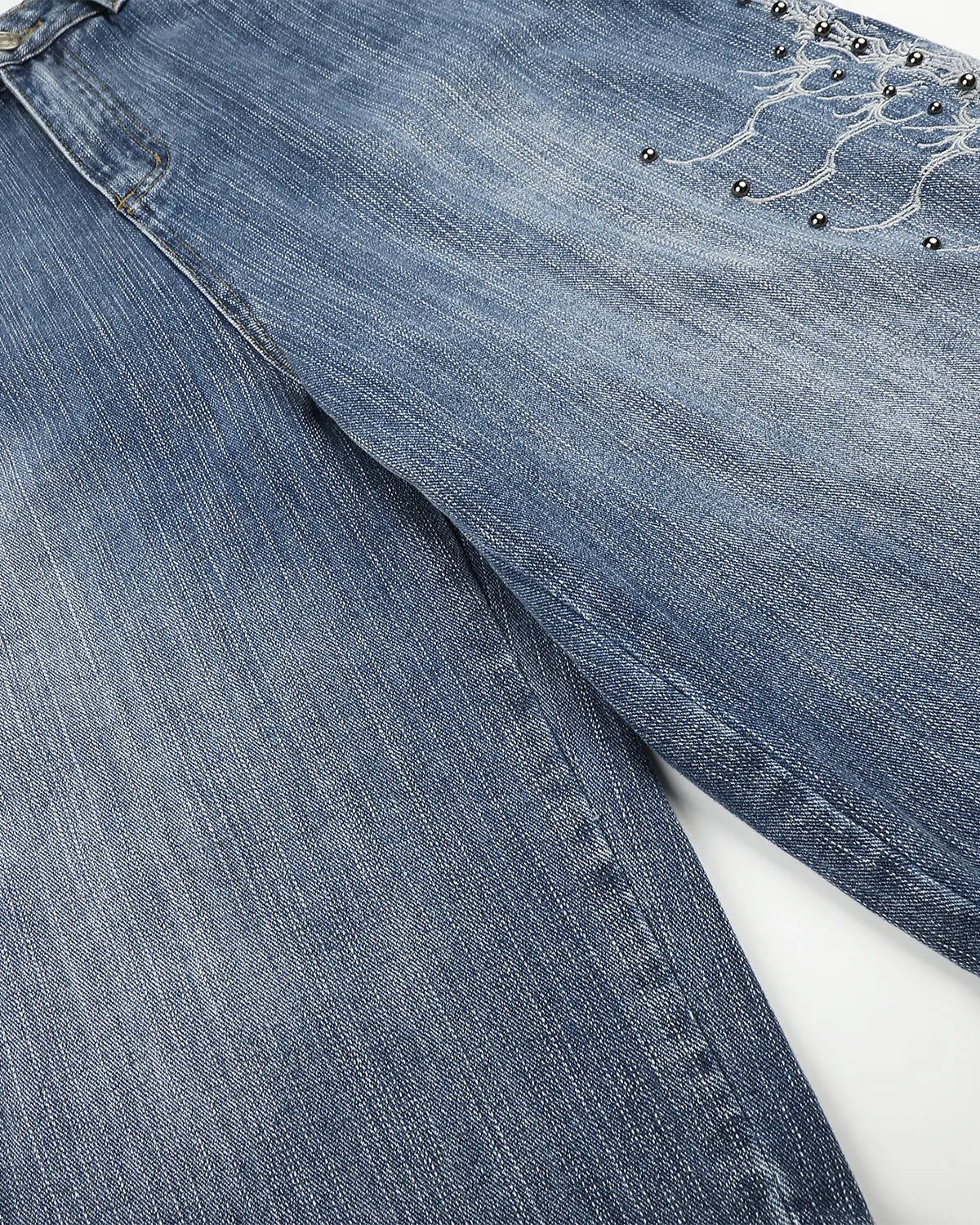 Inflation Studded Bamboo Weave Jorts, casual denim-style pants with metal stud accents, featuring bamboo-inspired woven design.