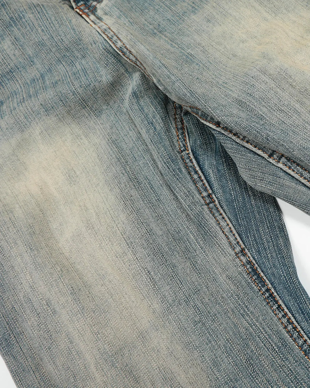 Washed bamboo weave baggy bootcut jeans by INFLATION, showcasing relaxed fit, distressed details, and bamboo-textured fabric.