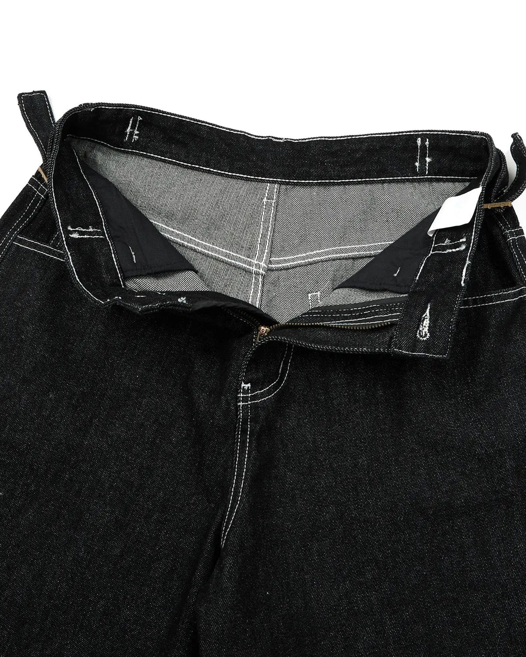 Inflation brand raw denim baggy jorts with adjustable tabs, featuring a relaxed fit and distressed details, designed for streetwear style.