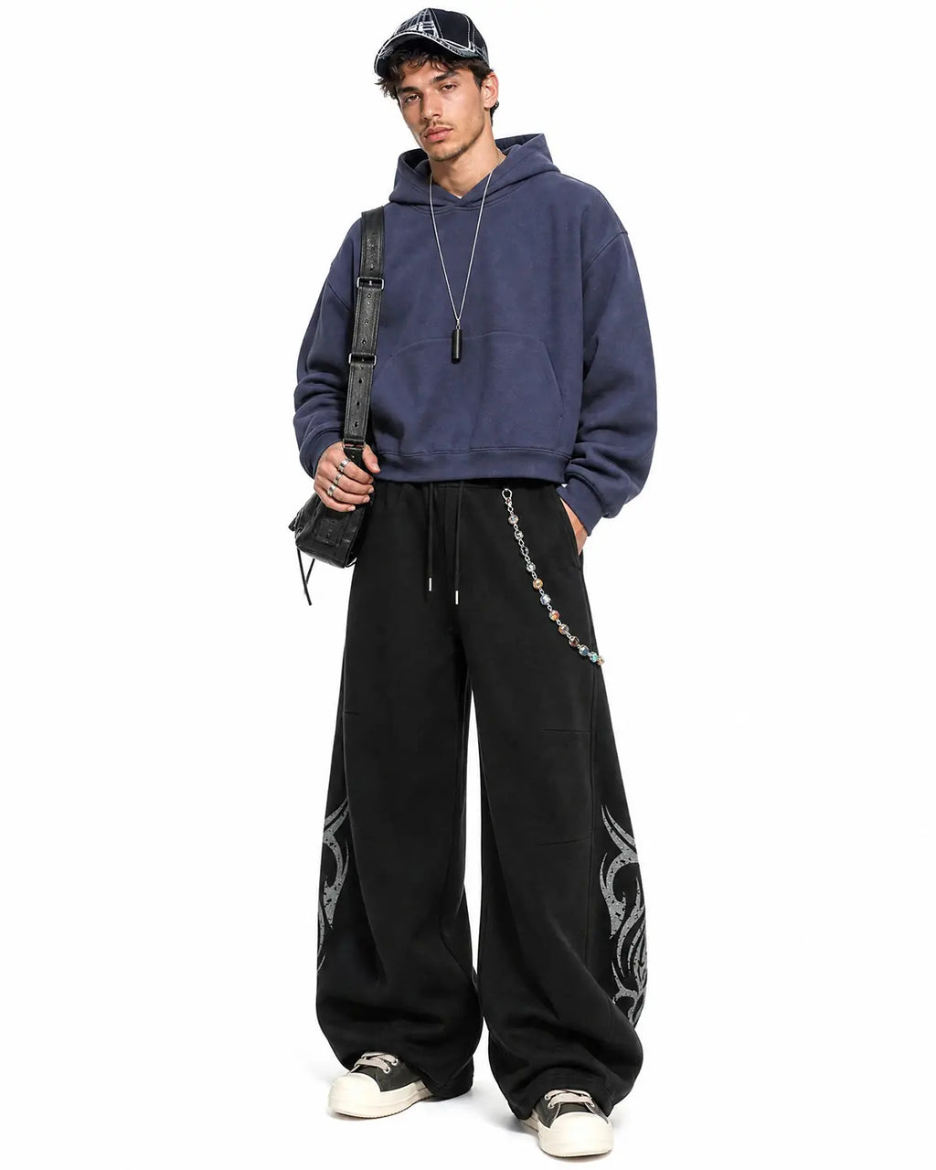 Washed distressed barrel sweatpants by INFLATION featuring a relaxed fit and faded, worn-in denim look with distressed details.