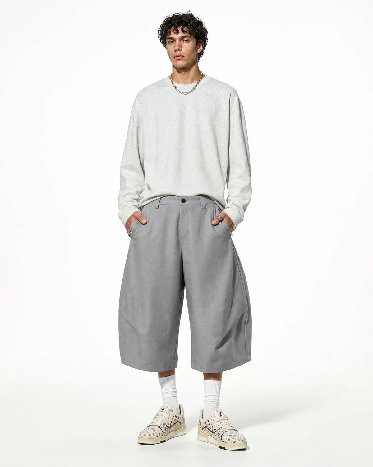 Inflation Streetwear pleated barrel tailored Bermuda shorts in neutral tones, showcasing a relaxed fit and stylish design.