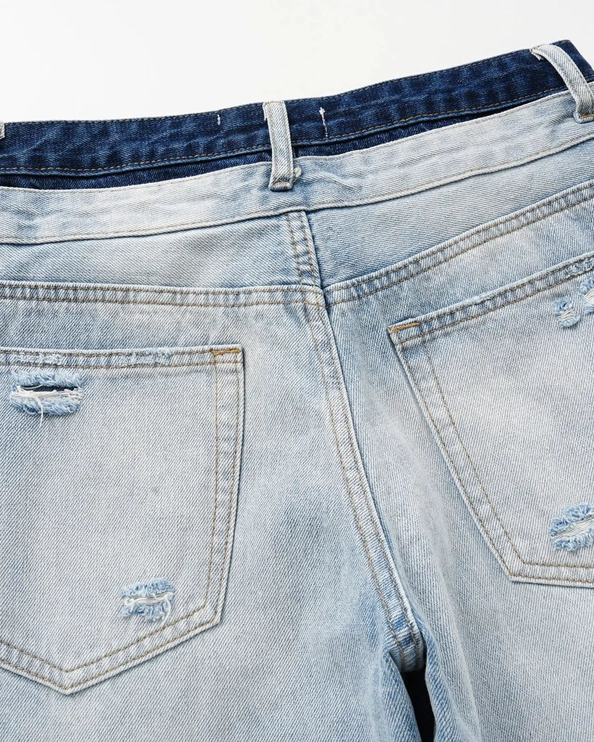 Inflation Double Waist Distressed Baggy Jeans with ripped details and relaxed fit, showcasing casual streetwear style.