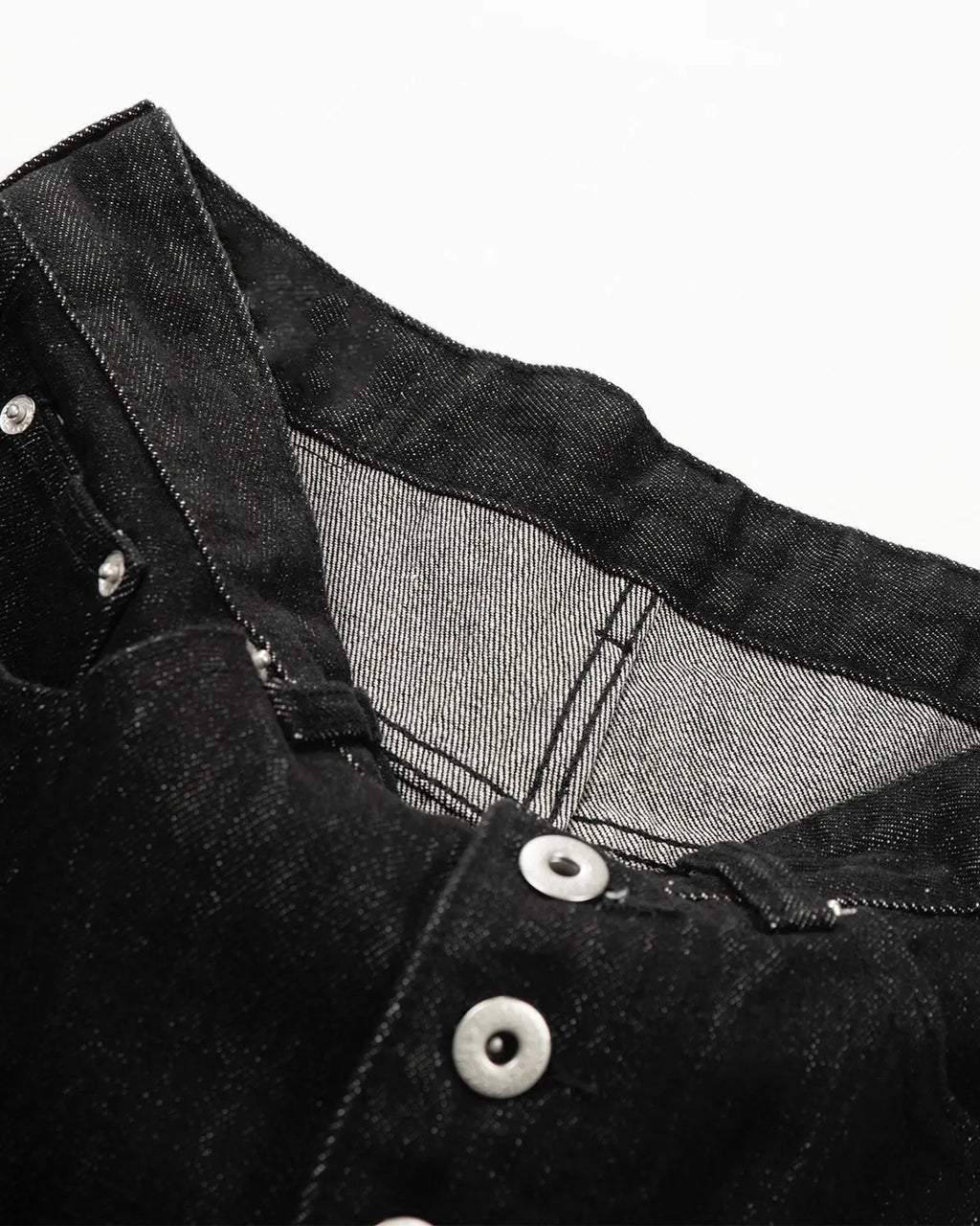 Raw Buttons Up Baggy Jeans by INFLATION, featuring loose fit, distressed denim, and button details on a casual streetwear style.