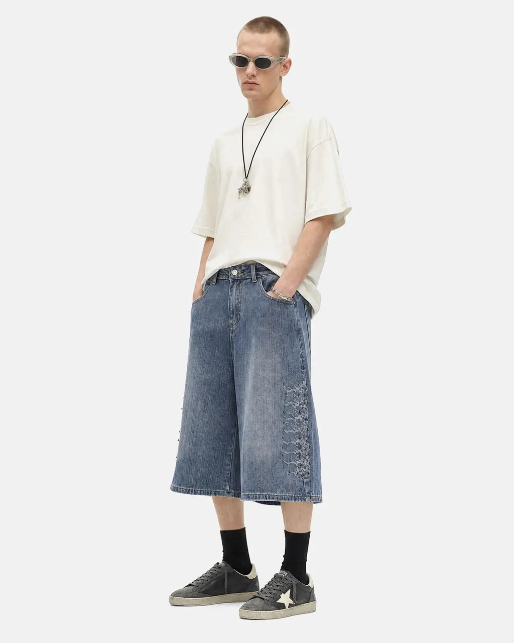 Inflation Streetwear studded bamboo weave jorts, men's casual pants with metallic embellishments and a rugged, stylish design.