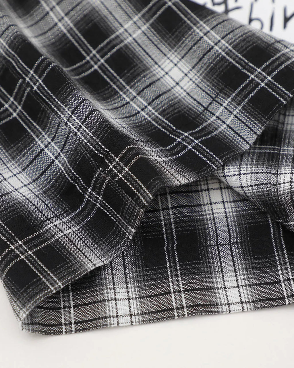 Inflation Streetwear plaid sticker graphic studded shirt featuring a bold plaid pattern and edgy stud details.