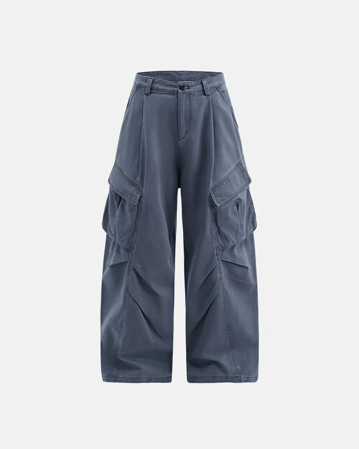 Inflation brand baggy cargo pants with multiple pockets, relaxed fit, and streetwear style, shown in a casual outdoor setting.