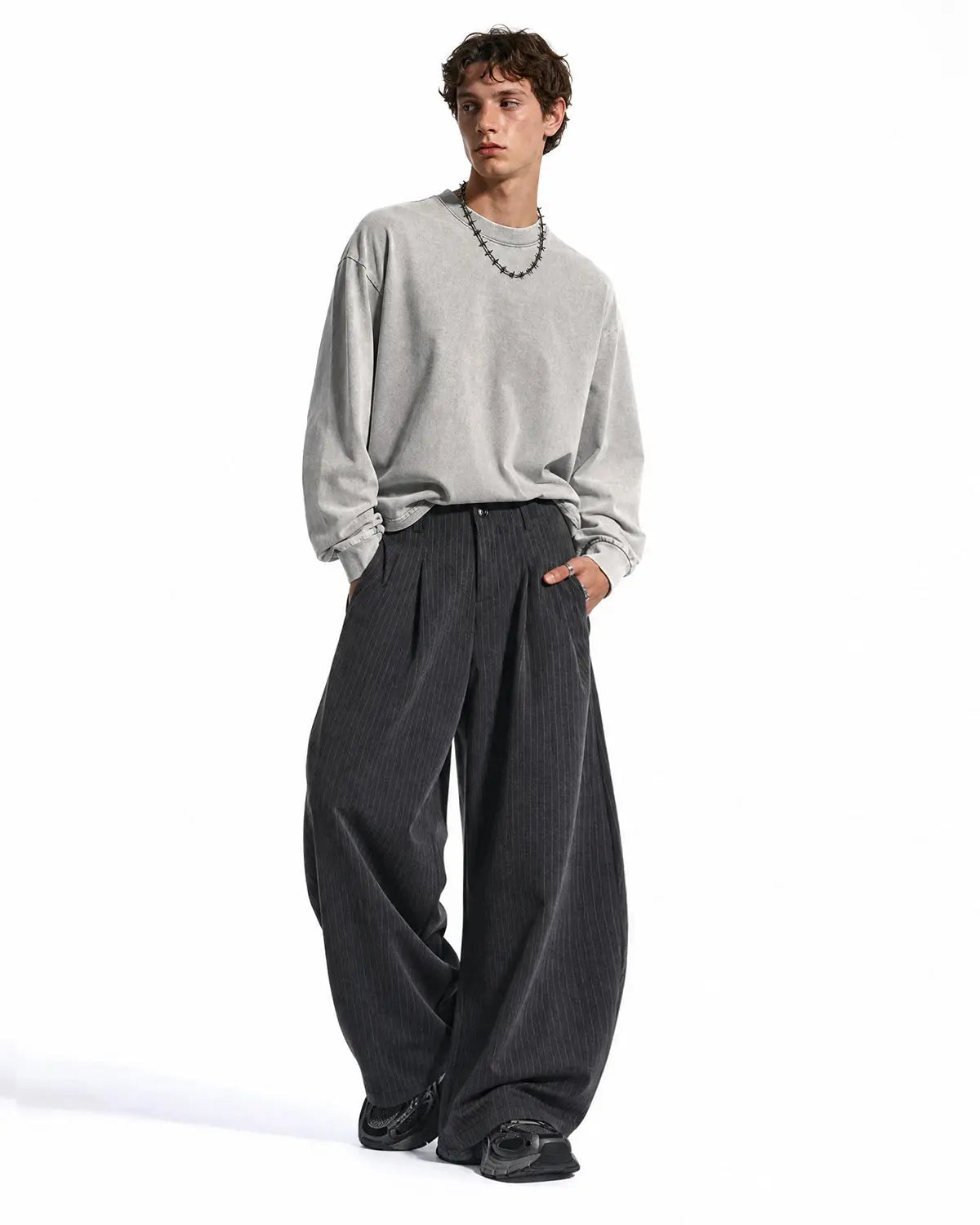Inflation Pinstripe Pleated Barrel Pants featuring tailored fit and stylish design, displayed on a hanger against a plain background.