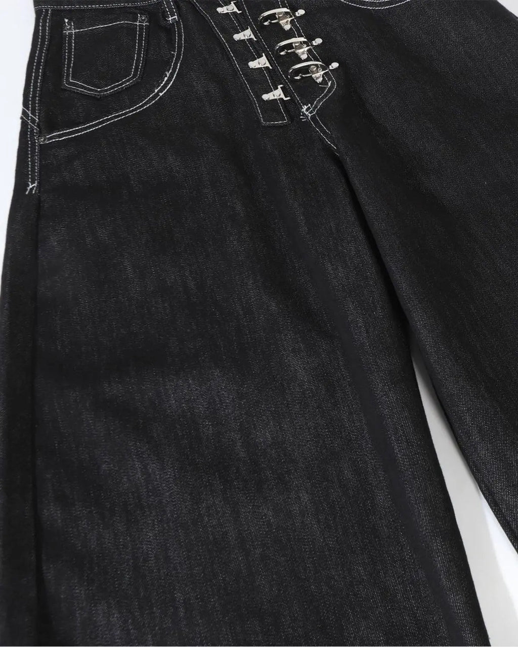 Raw metal clasp baggy jeans by INFLATION featuring a relaxed fit and distressed denim style, styled for streetwear fashion.