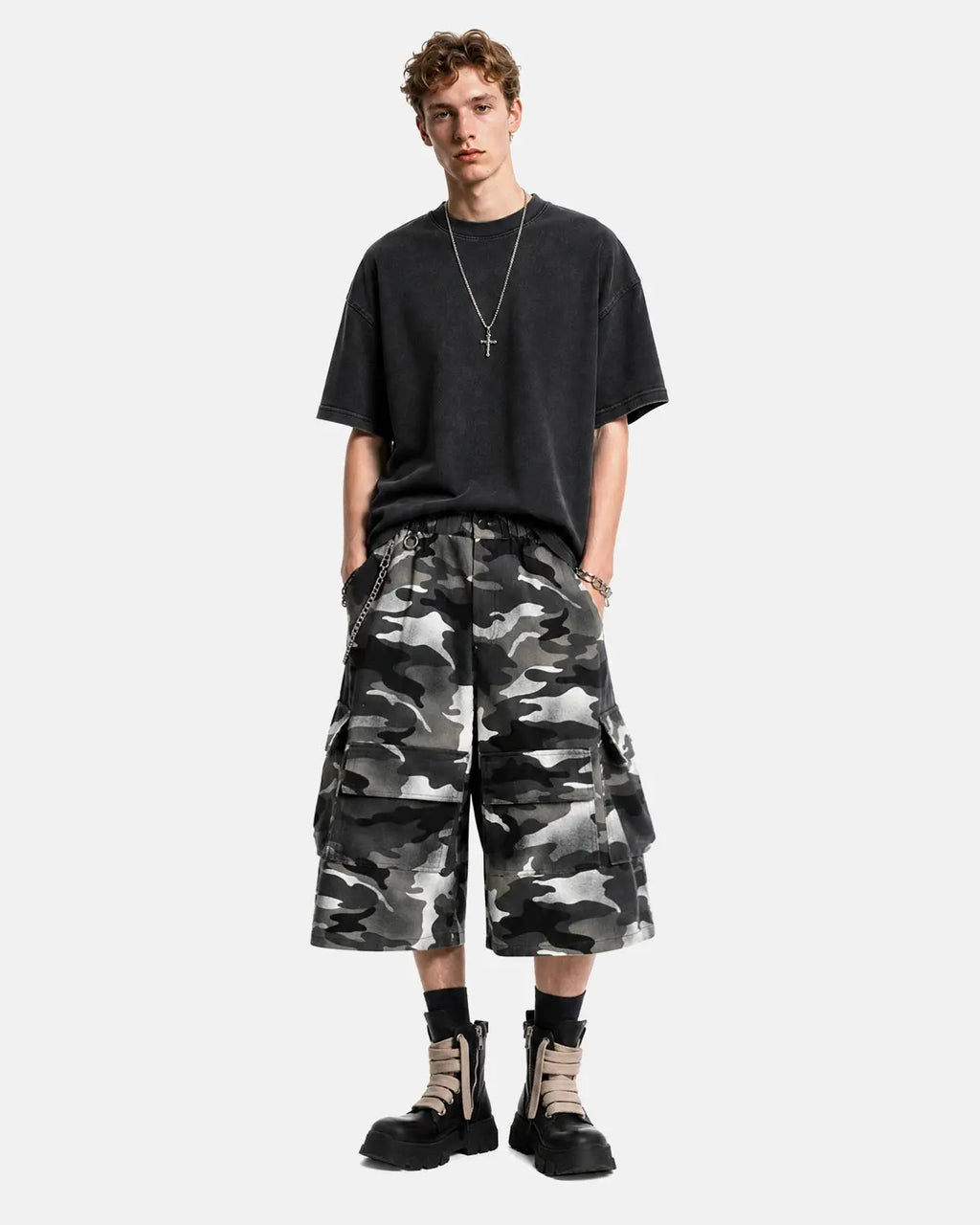 Grey camo utility longline shorts by INFLATION Streetwear featuring multiple pockets and a relaxed fit.