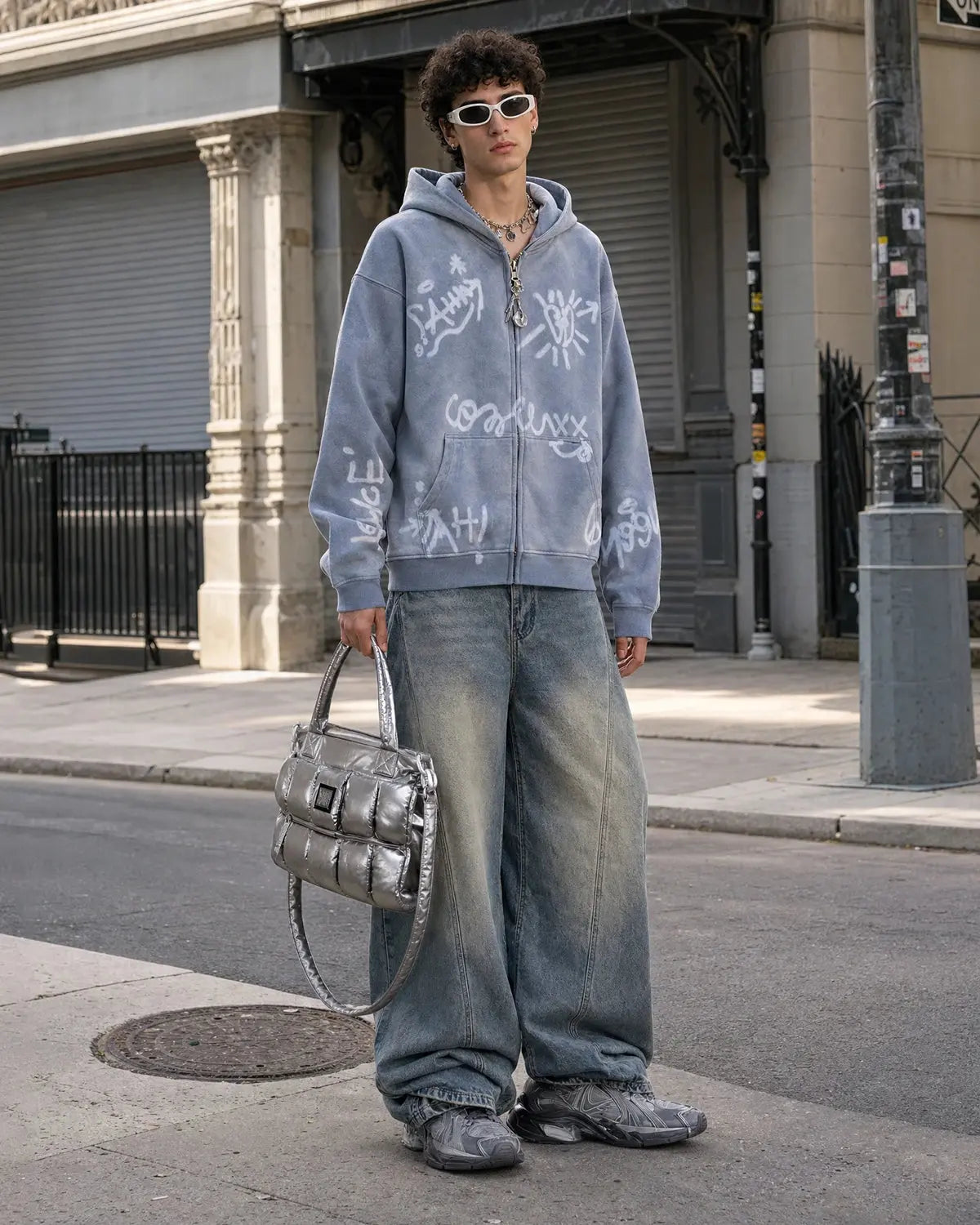 Inflation graffiti washed zip-up hoodie featuring colorful graffiti design and casual fit, displayed on a hanger against a plain background.