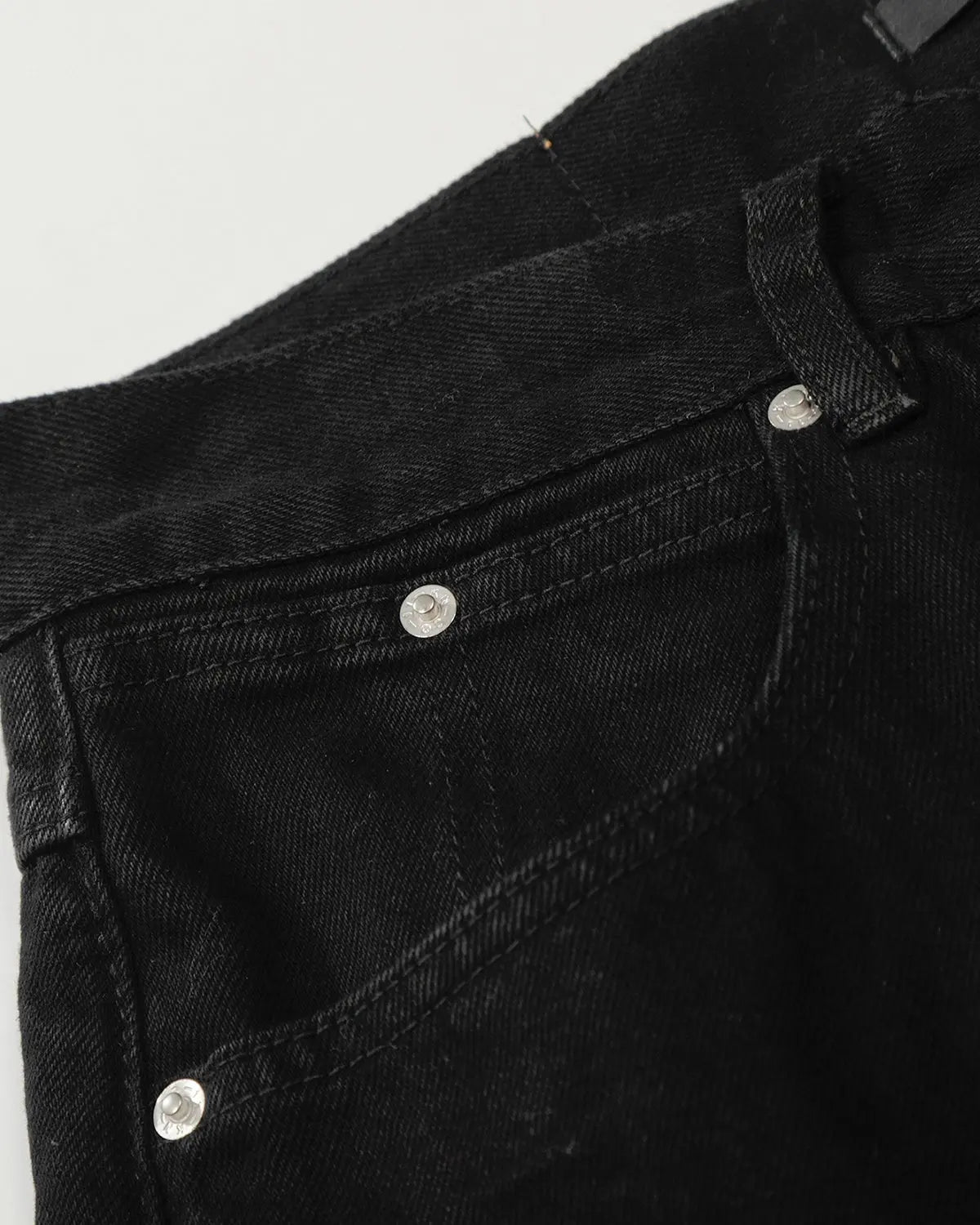 Black baggy jeans from Inflation Streetwear with a relaxed fit and casual style, displayed on a hanger.
