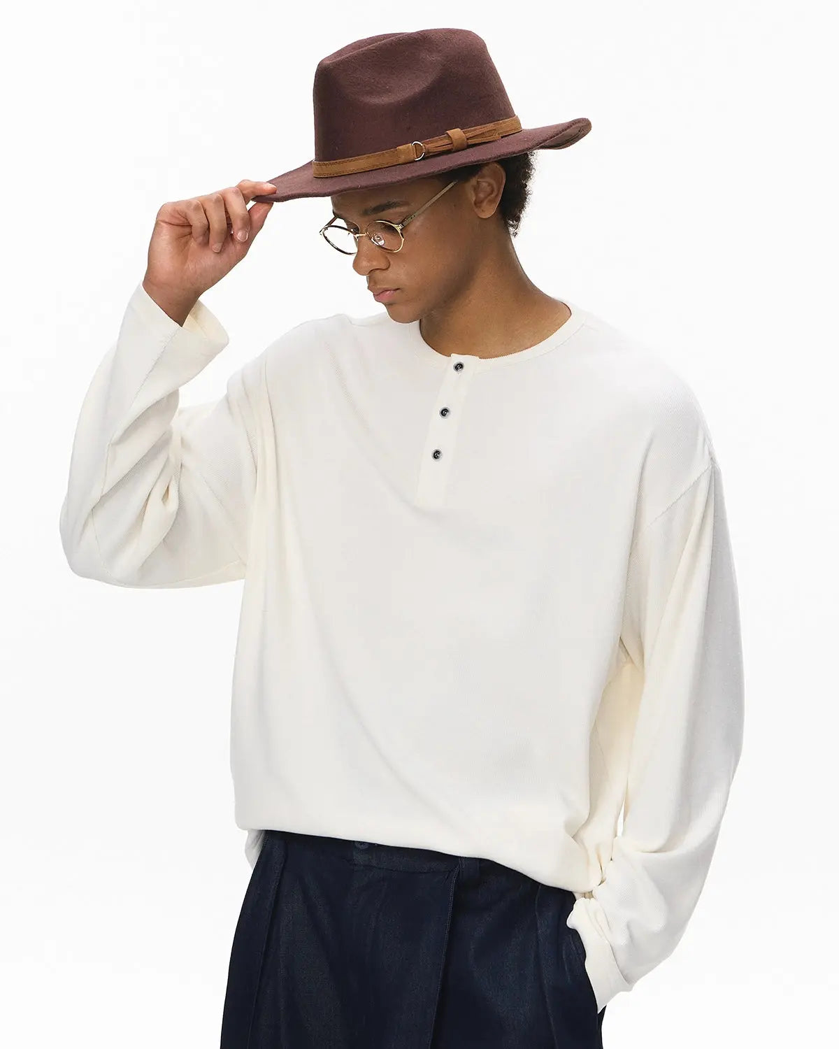 Inflation Streetwear Henley collar long sleeve T-shirt in black, featuring a casual fit and ribbed cuffs.