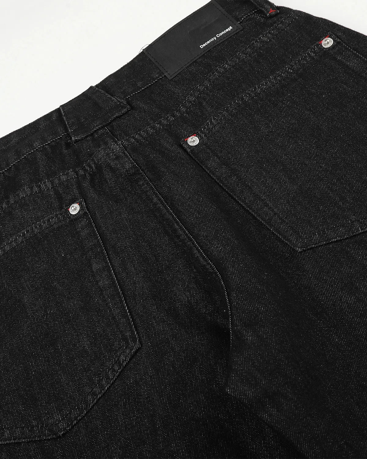 Inflation Streetwear barrel jeans with side eyelet buttons, showcasing the denim fabric and stylish button details.