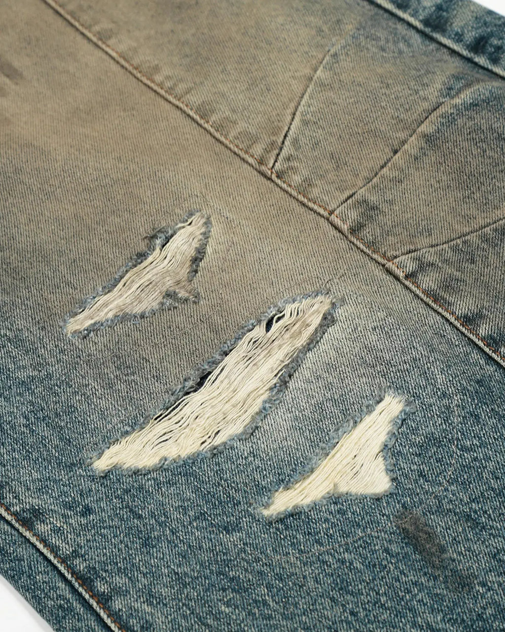 Distressed Dirty Wash Barrel Jeans by INFLATION featuring a rugged, worn-in look and relaxed fit, made of denim with distressed details.