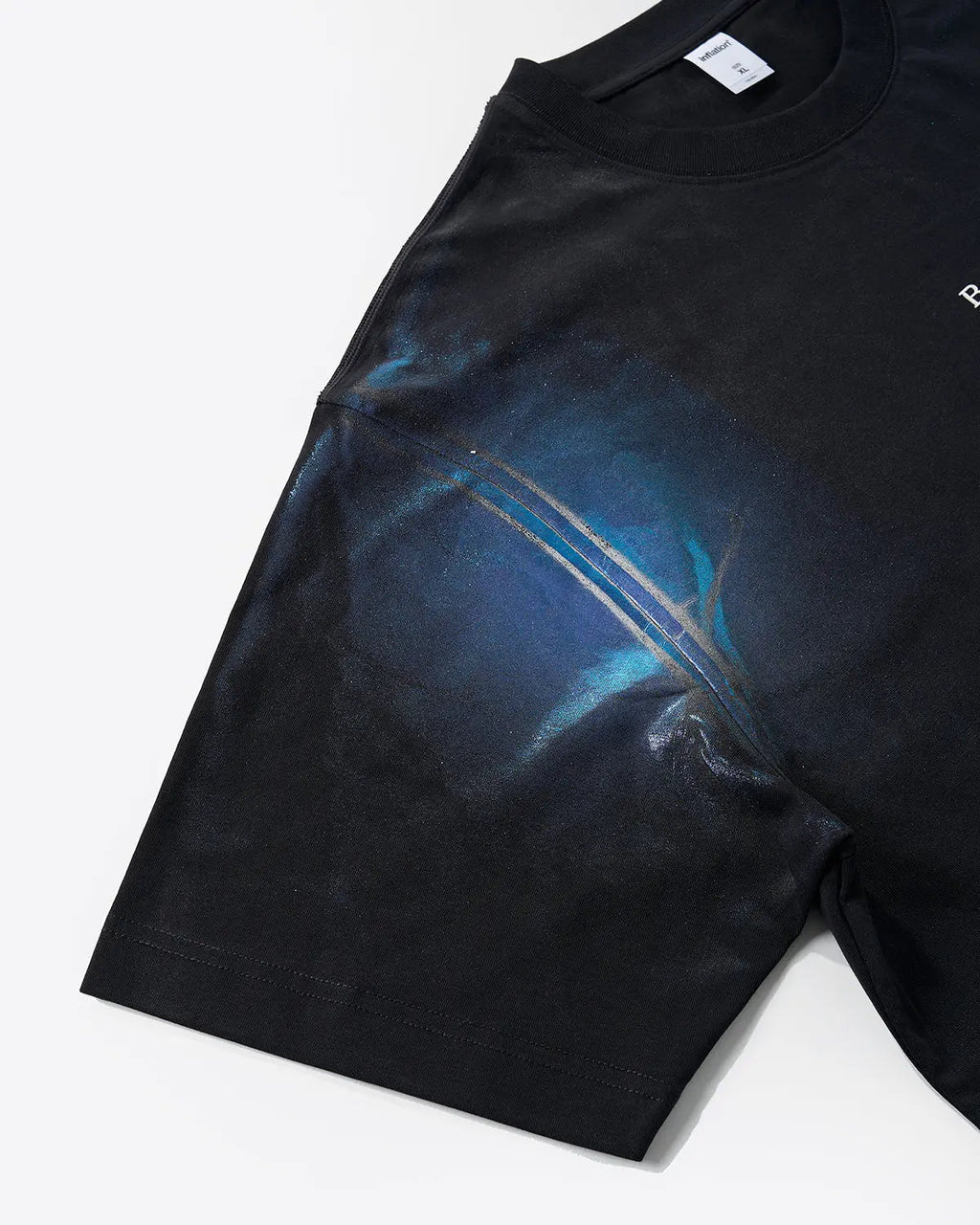 Iridescent shimmer oversized T-shirt by INFLATION Streetwear featuring a glossy, reflective fabric and relaxed fit.