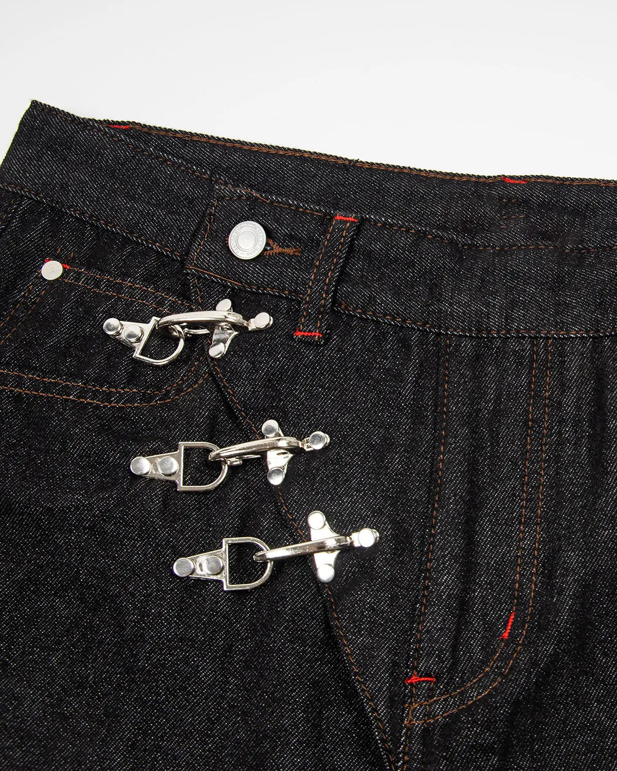 Asymmetric buckle raw baggy jeans by INFLATION featuring a relaxed fit and distinctive asymmetrical buckle design.