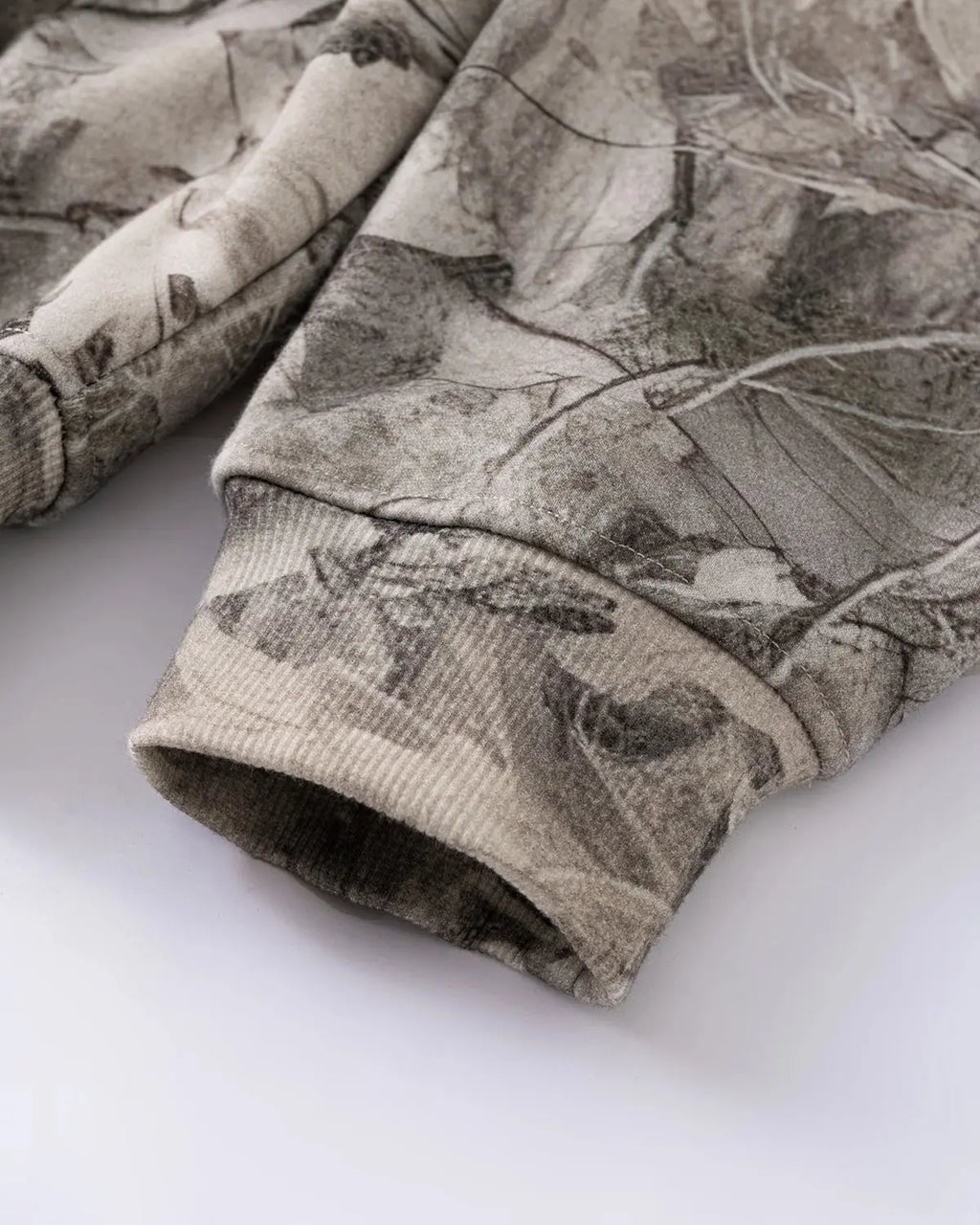 Inflation brand Realtree camo zip-up hoodie with front pockets and adjustable drawstrings, casual streetwear style.