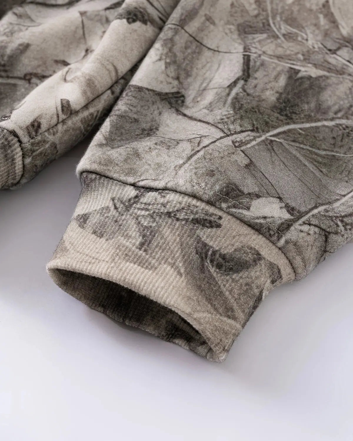 Inflation brand Realtree camo zip-up hoodie with front pockets and adjustable drawstrings, casual streetwear style.