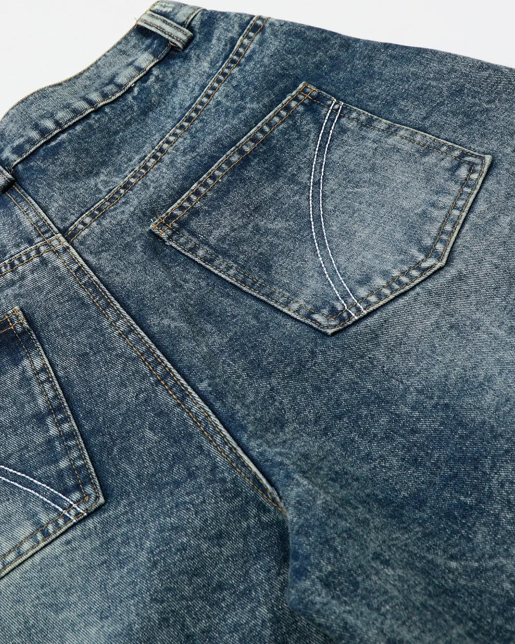Inflation brand studded washed long baggy jorts, denim pants with metal studs, relaxed fit, casual streetwear style.