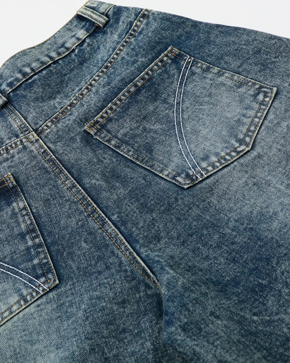 Inflation brand studded washed long baggy jorts, denim pants with metal studs, relaxed fit, casual streetwear style.