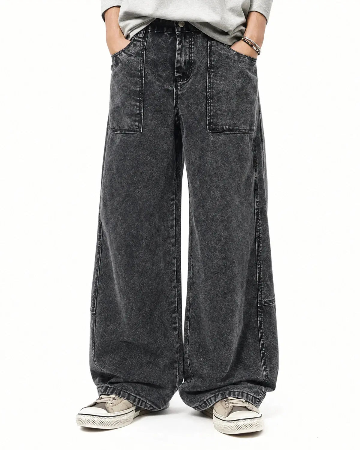 Deconstructed distressed barrel jeans by INFLATION featuring ripped details and a relaxed fit, stylish streetwear denim for casual outfits.