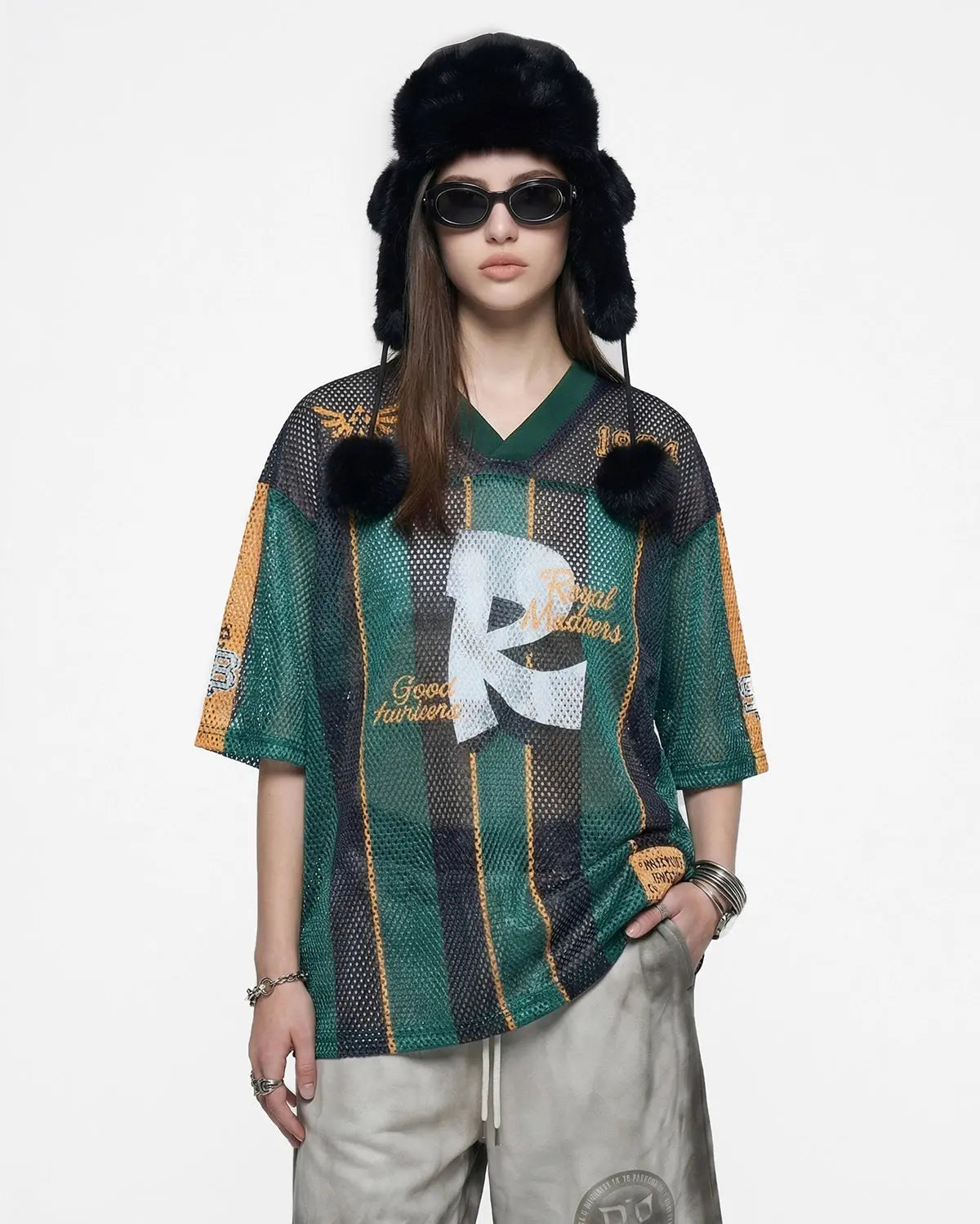 Vintage striped mesh jersey by INFLATION, featuring breathable mesh fabric with colorful horizontal stripes and a relaxed streetwear style.