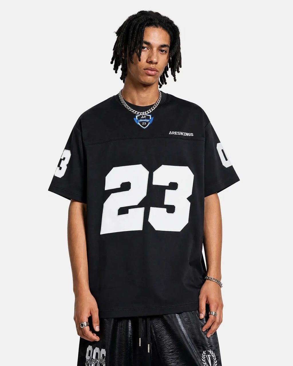 Inflation Streetwear varsity number applique T-shirt with bold embroidered number on white cotton fabric.