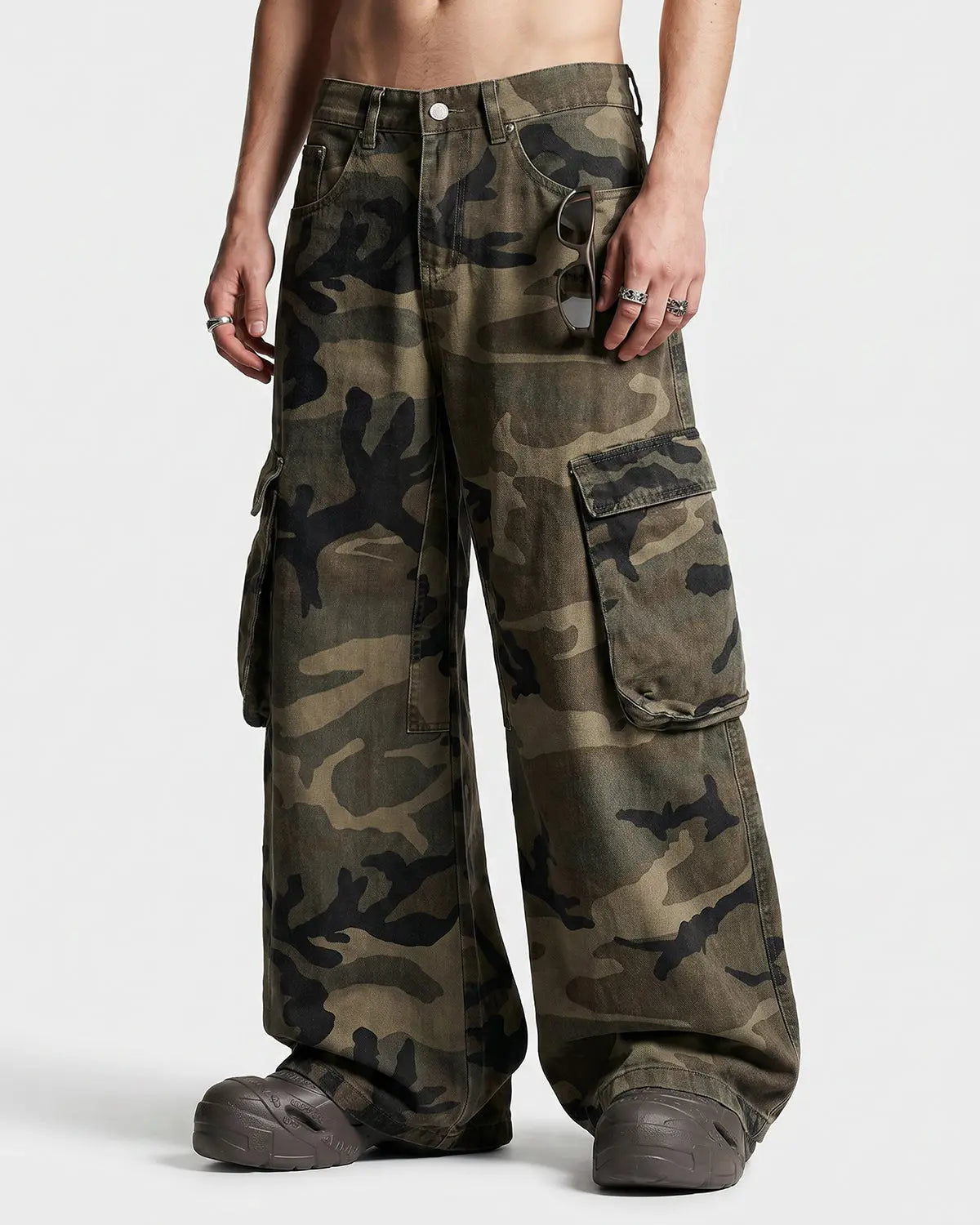 Inflation Camo Cargo Barrel Pants featuring camouflage pattern, multiple pockets, and relaxed streetwear style.