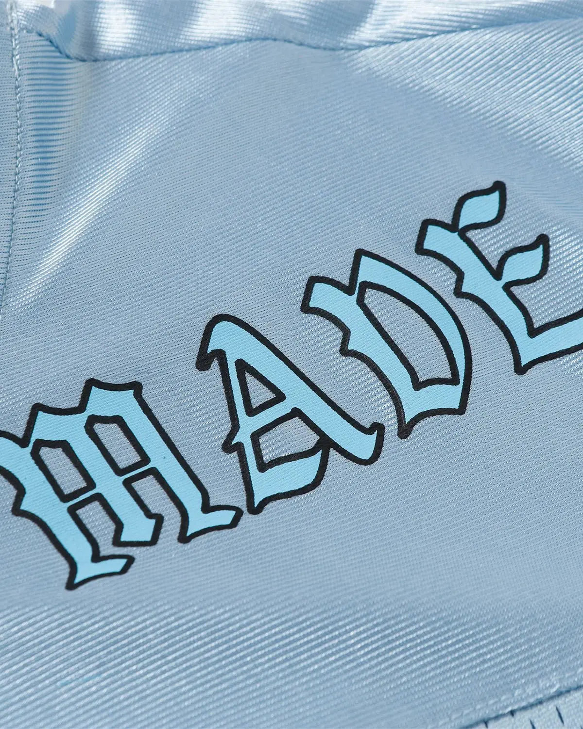 Oversized mesh patchwork jersey by INFLATION, featuring mixed fabric panels and a relaxed streetwear style.