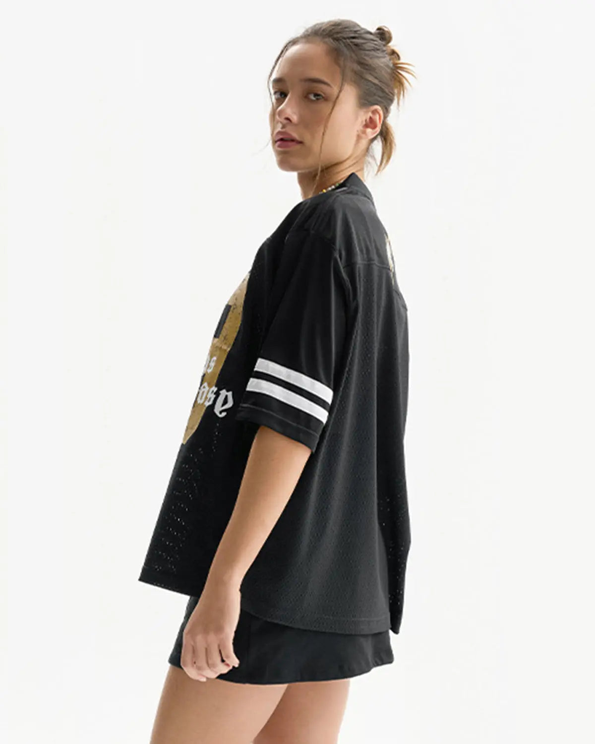 Satin patchwork mesh jersey by INFLATION featuring a stylish patchwork design and lightweight, sheer fabric for streetwear fashion.