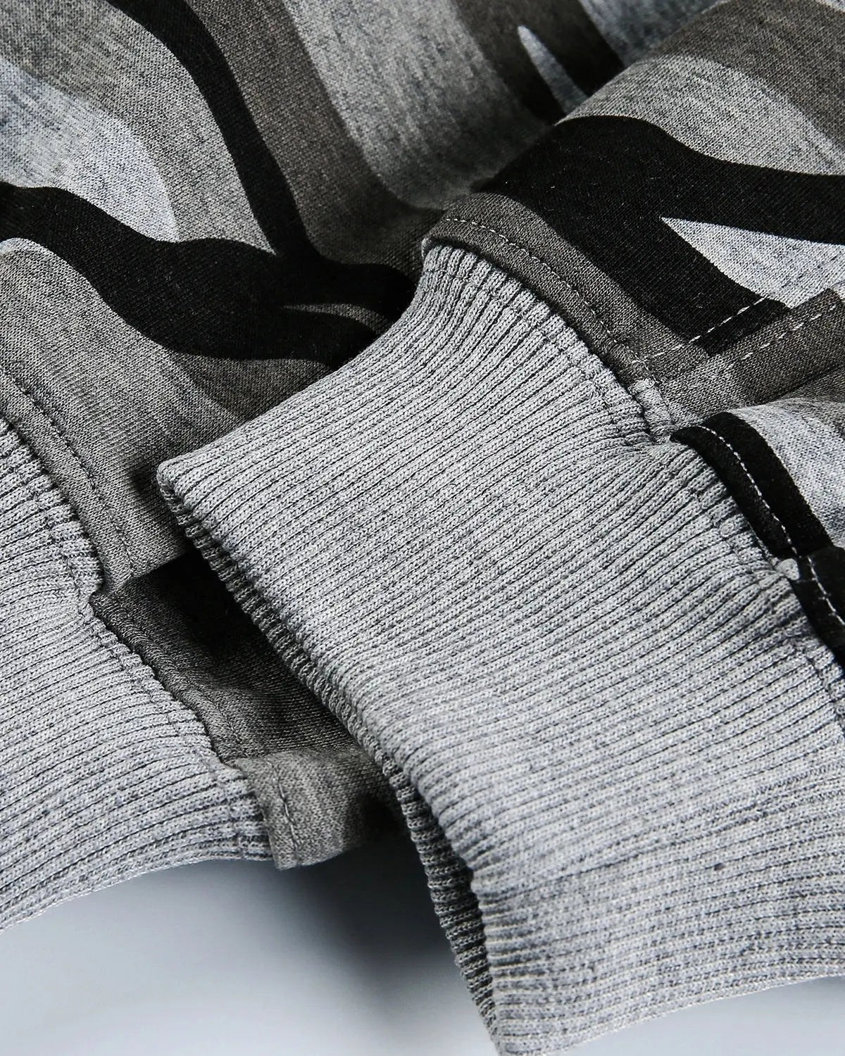 Cropped camouflage zip-up hoodie by INFLATION featuring a military print, front zipper, and casual streetwear style.
