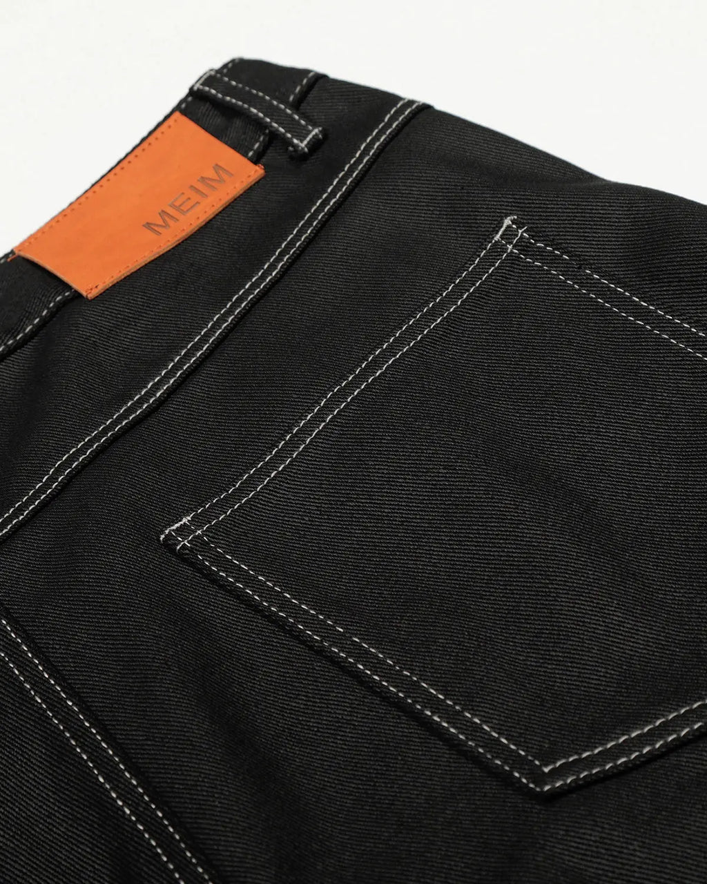 Letter graphic cargo barrel jeans by INFLATION featuring distressed denim, multiple pockets, and a relaxed streetwear style.