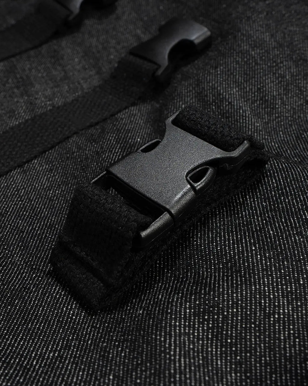 Raw denim tactical cargo jorts by INFLATION, durable combat-style pants with multiple pockets and a rugged streetwear look.