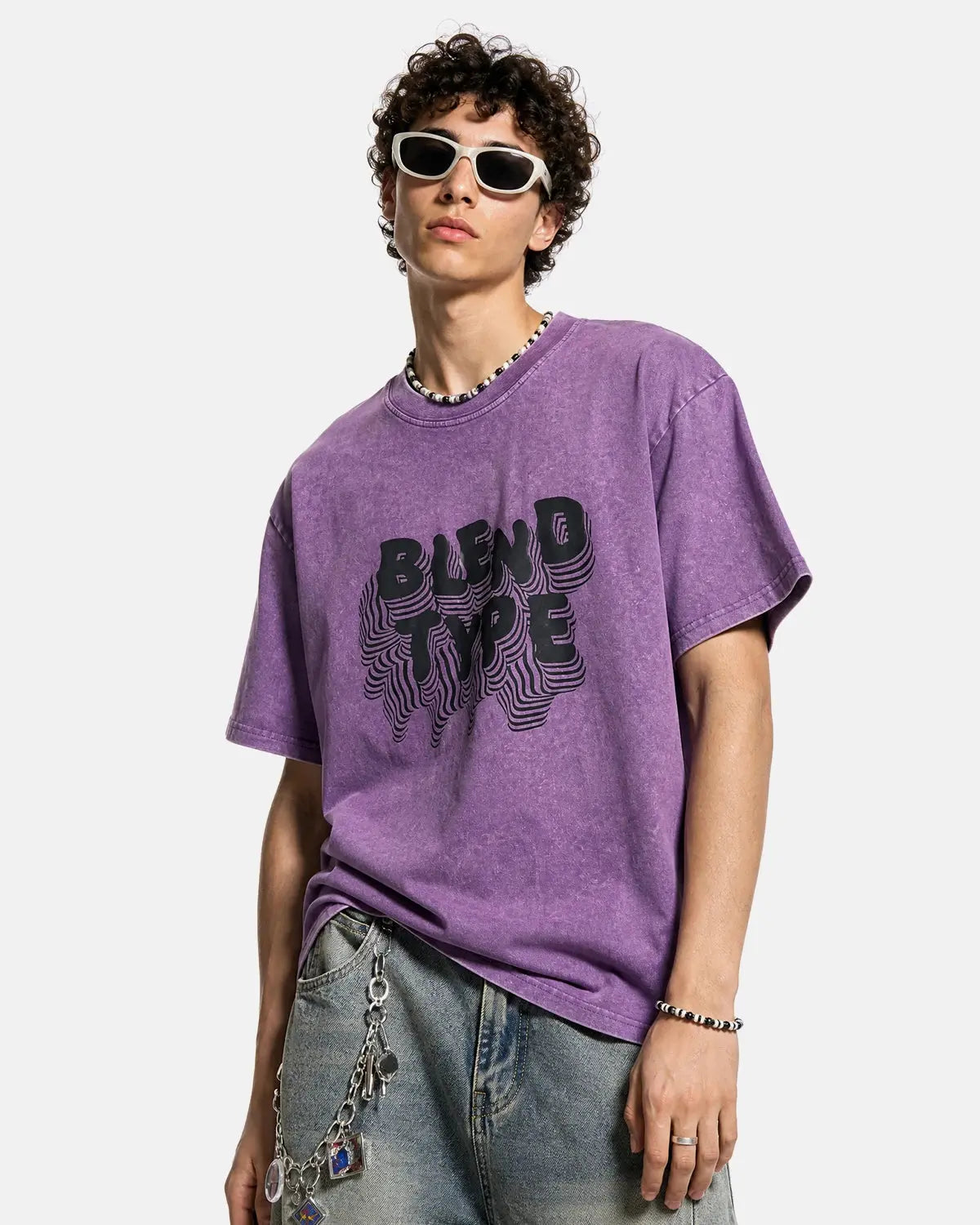Purple washed oversized graphic T-shirt by INFLATION with bold print and relaxed fit, displayed flat on a neutral background.