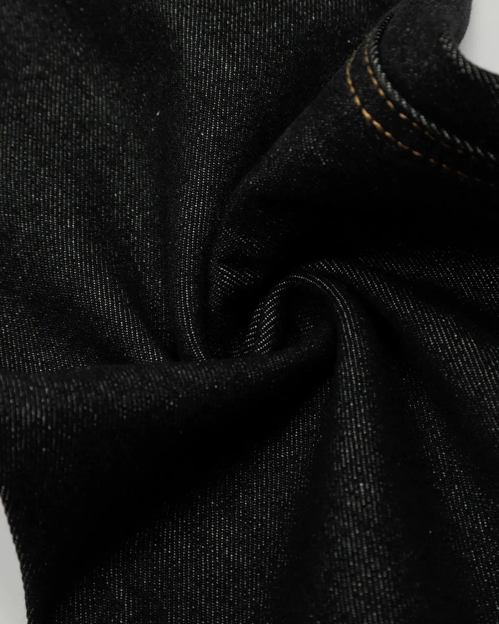 Raw Embroidery Baggy Jeans by INFLATION featuring distressed denim, loose fit, and raw embroidery details on the streetwear style jeans.