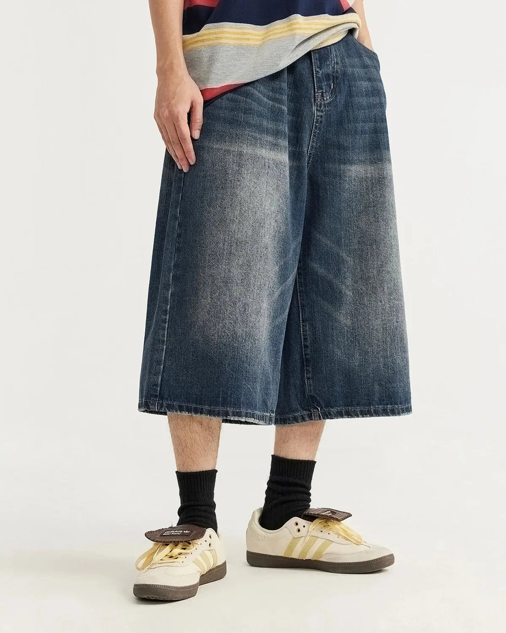 Acid washed longline baggy denim jorts pants by INFLATION, featuring a relaxed fit and distressed denim style.