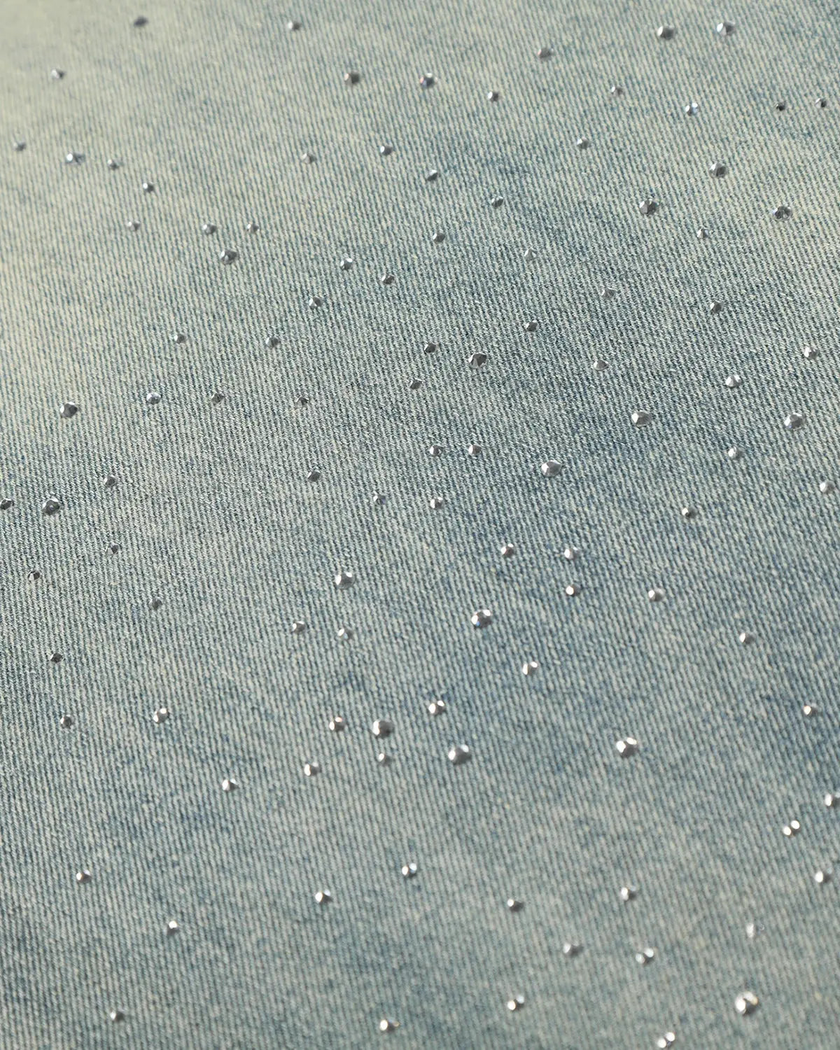 Acid wash rhinestone baggy jeans by INFLATION with distressed details and rhinestone embellishments, relaxed streetwear style.