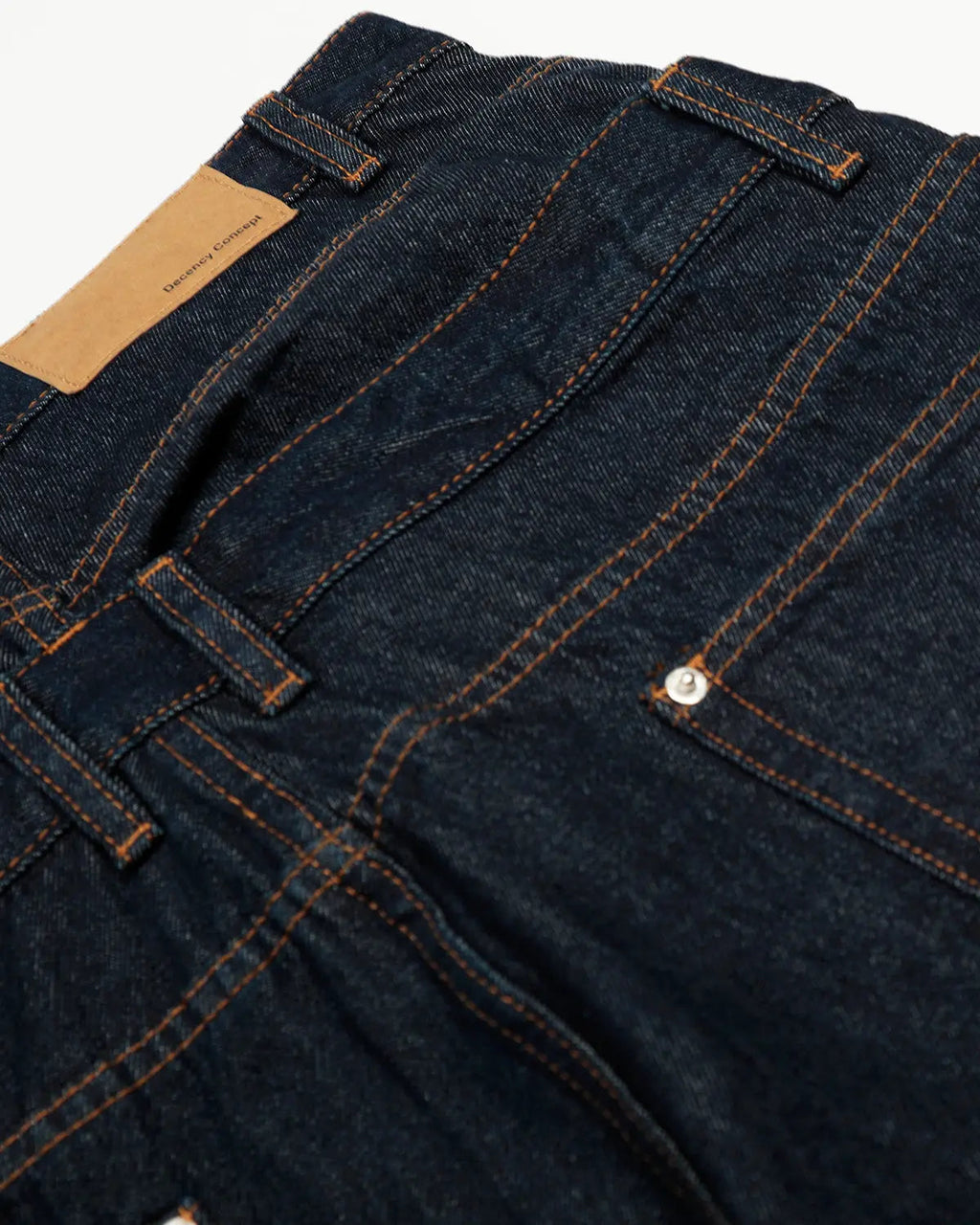 Inflation streetwear double waist raw baggy jeans with distressed details and relaxed fit, displayed on a hanger.