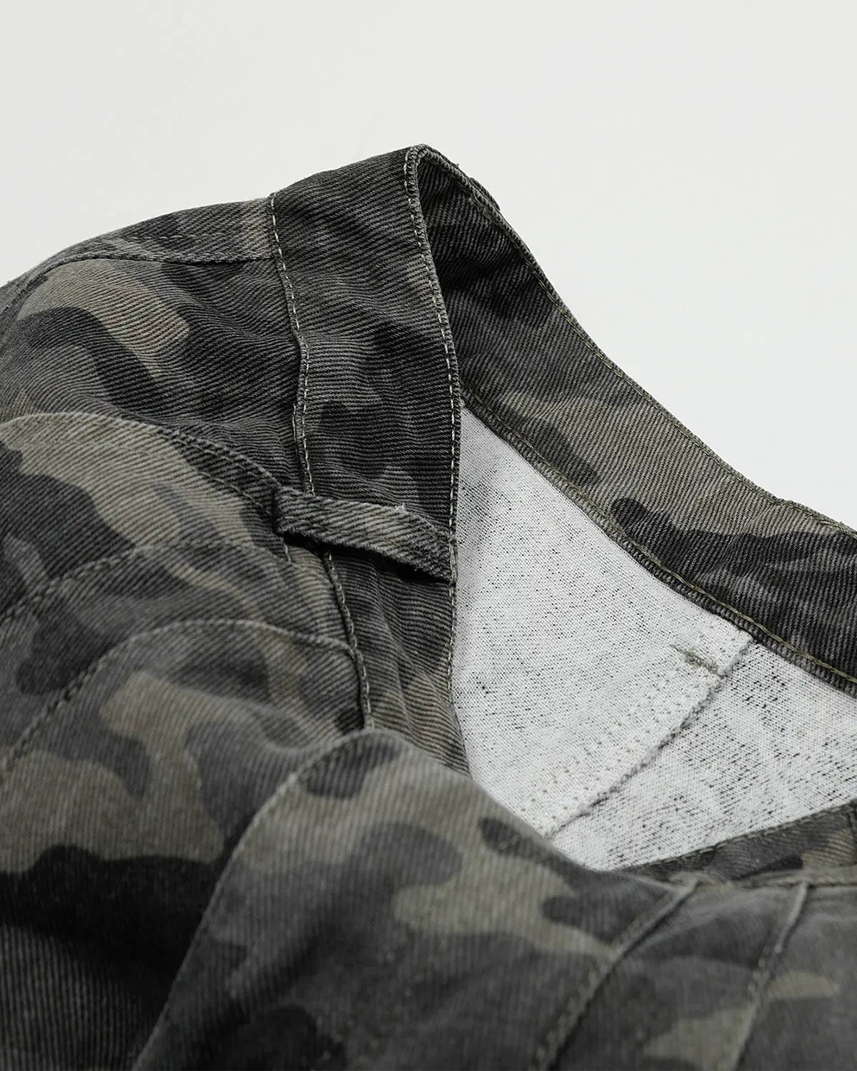 Inflation Streetwear embroidered camo cargo shorts, casual pants with detailed stitching and multiple pockets, military-inspired style.