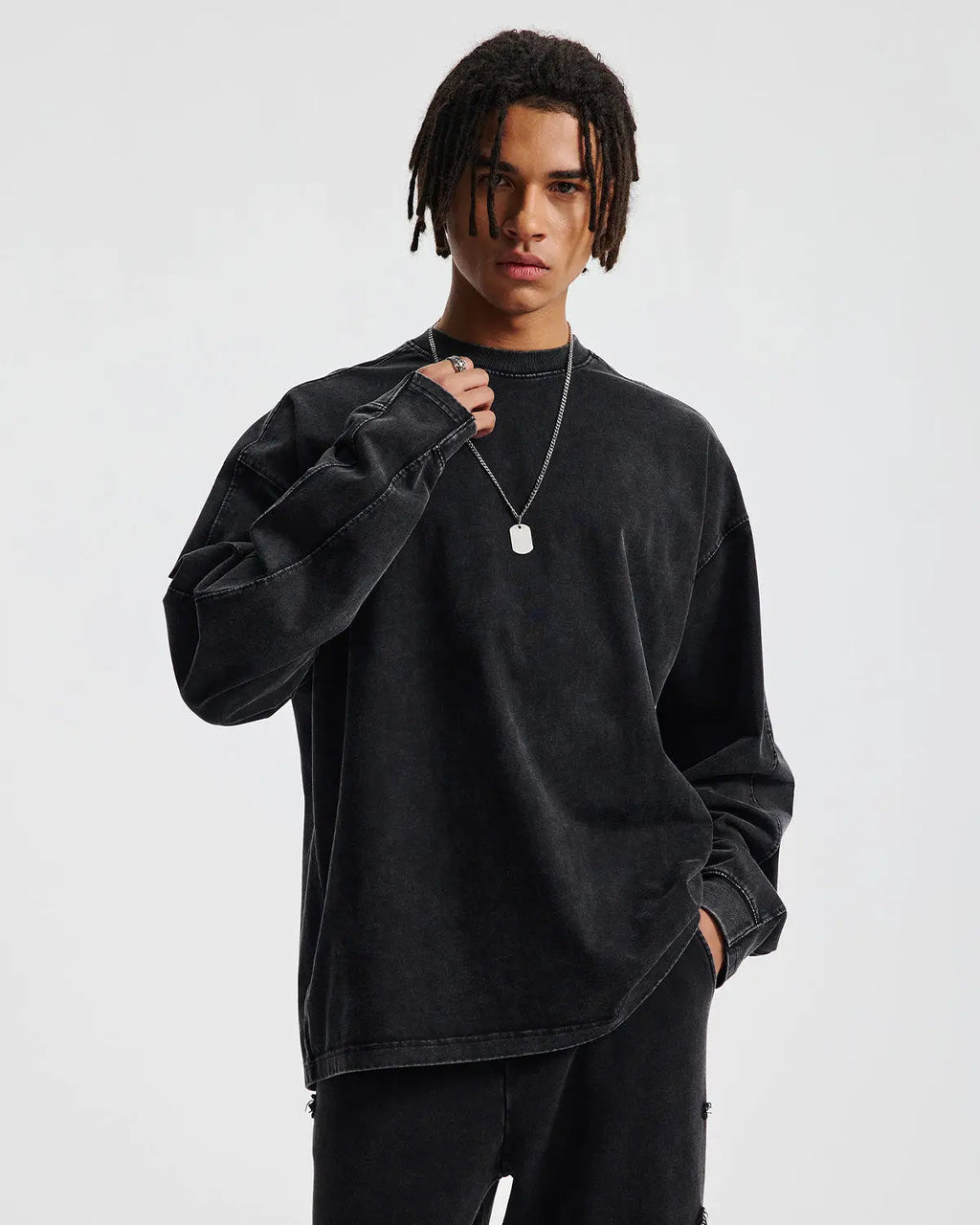 Inflation streetwear distressed acid wash oversized long sleeve T-shirt, casual and trendy with a worn, vintage look.