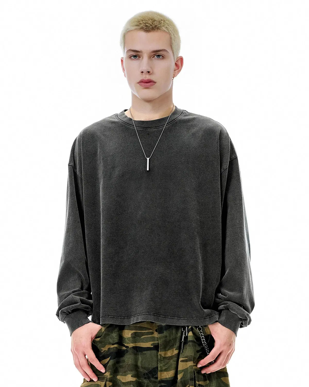 Distressed washed long sleeve T-shirt by INFLATION, featuring a relaxed fit with a worn, vintage look and subtle fading.
