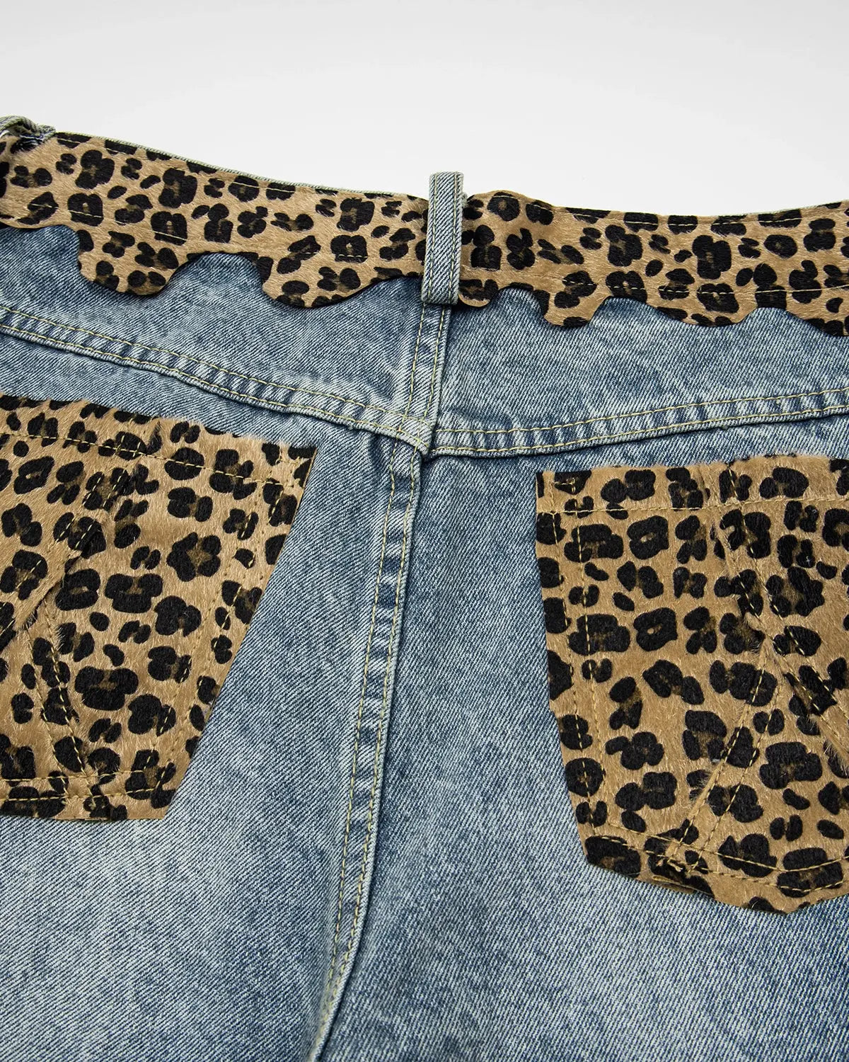 Inflation brand leopard patchwork jorts, trendy denim pants with bold leopard print and patchwork design, casual streetwear style.