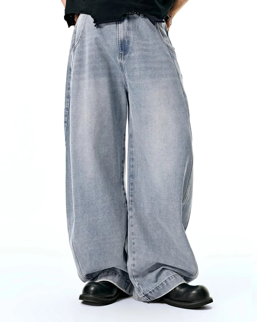 Inflation washed barrel baggy jeans, relaxed fit pants with faded denim wash and casual style, shown on a model.