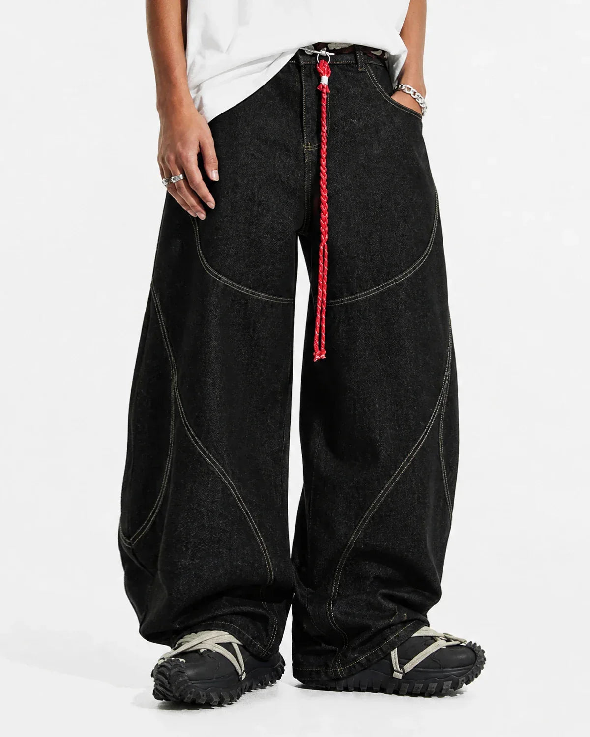 Acid wash baggy jeans with stitching details from INFLATION Streetwear, featuring a relaxed fit and distressed denim style.