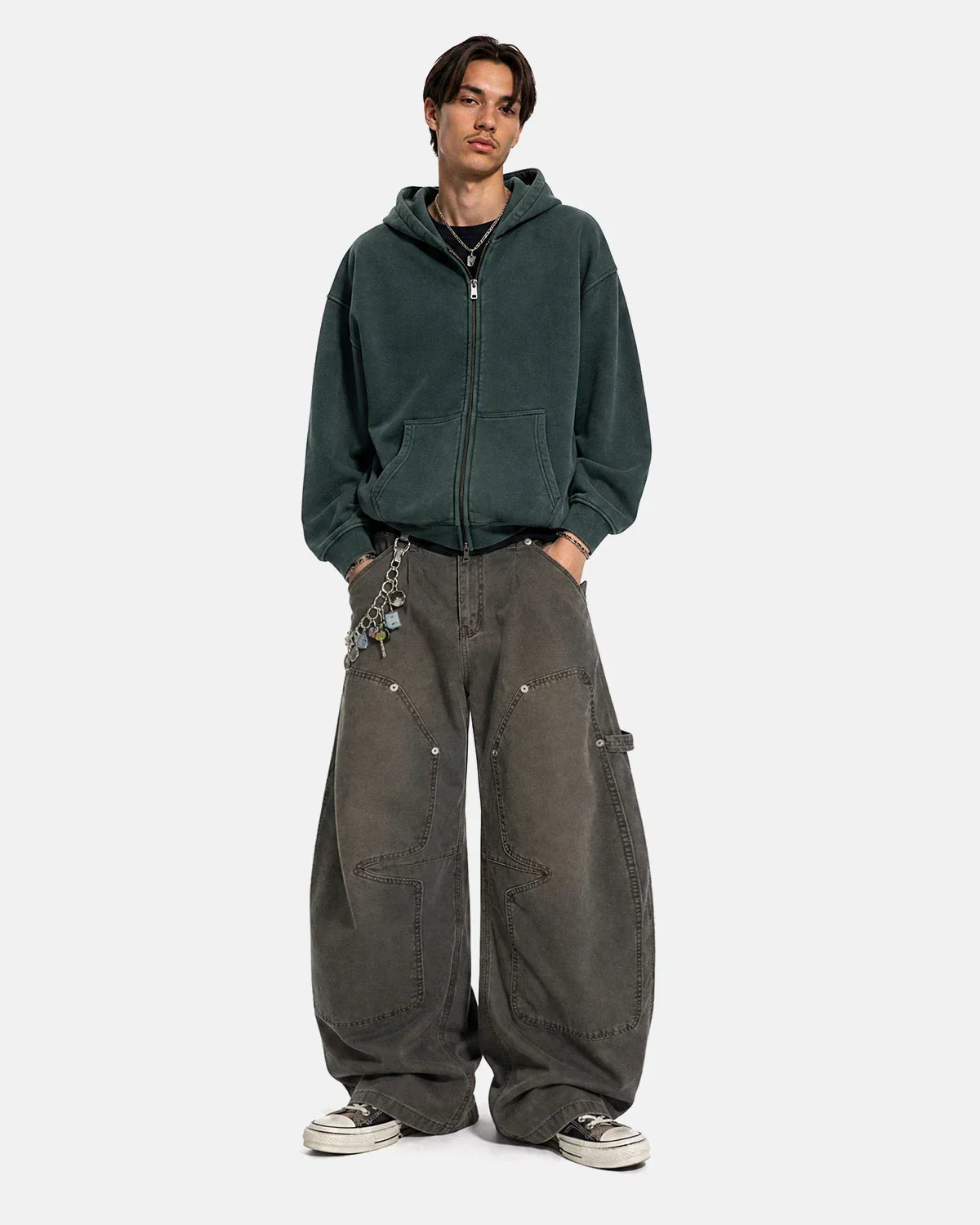 Washed barrel cargo pants by INFLATION, streetwear style with multiple pockets and relaxed fit, shown in a casual outdoor setting