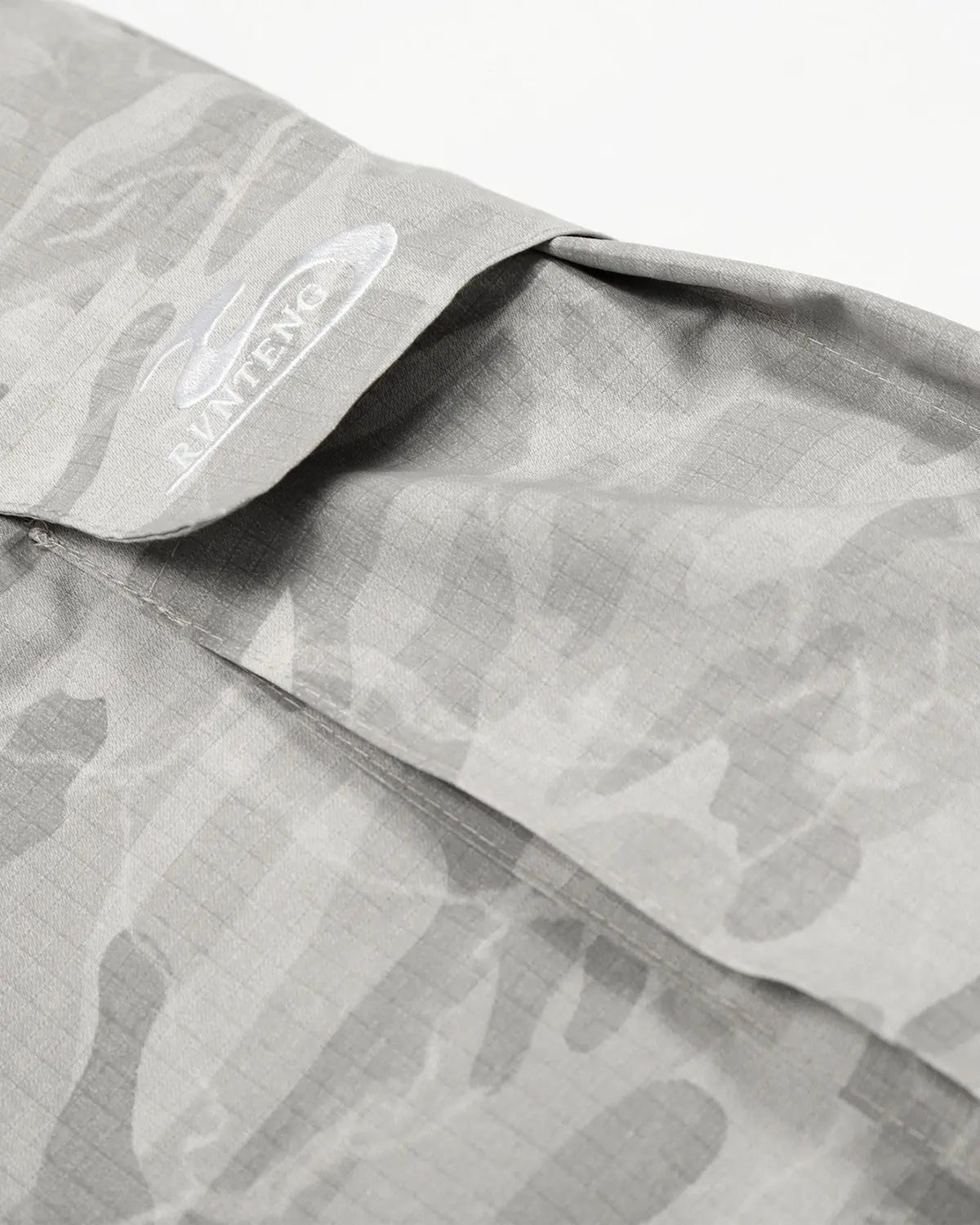 Camouflage cargo barrel pants by INFLATION featuring a streetwear style with multiple pockets and relaxed fit.