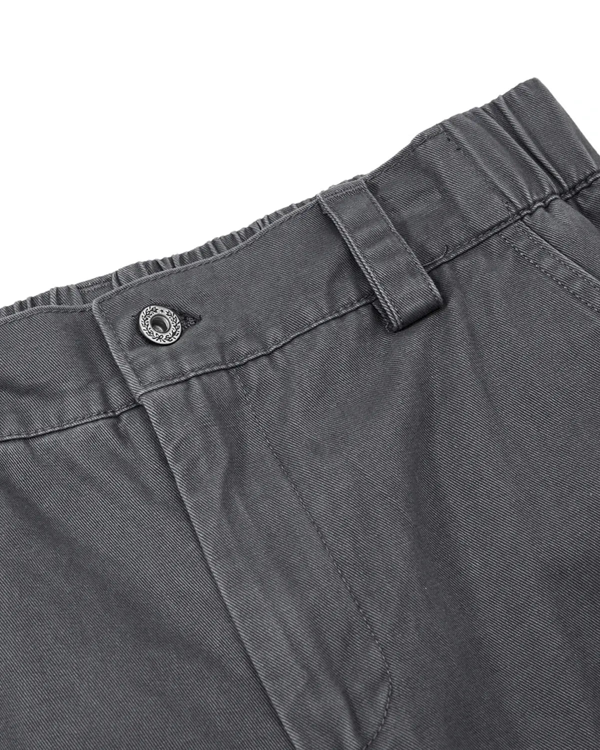 Washed curved seam cargo pants by INFLATION, streetwear style with relaxed fit, featuring multiple pockets and curved seam details.