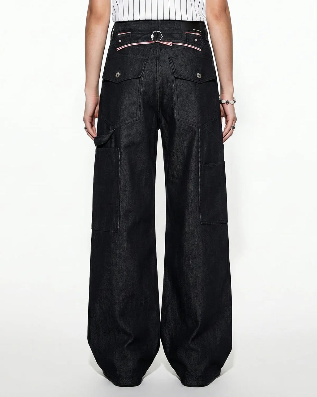 Deconstructed utility baggy jeans by INFLATION featuring oversized fit, multiple pockets, and distressed denim details.