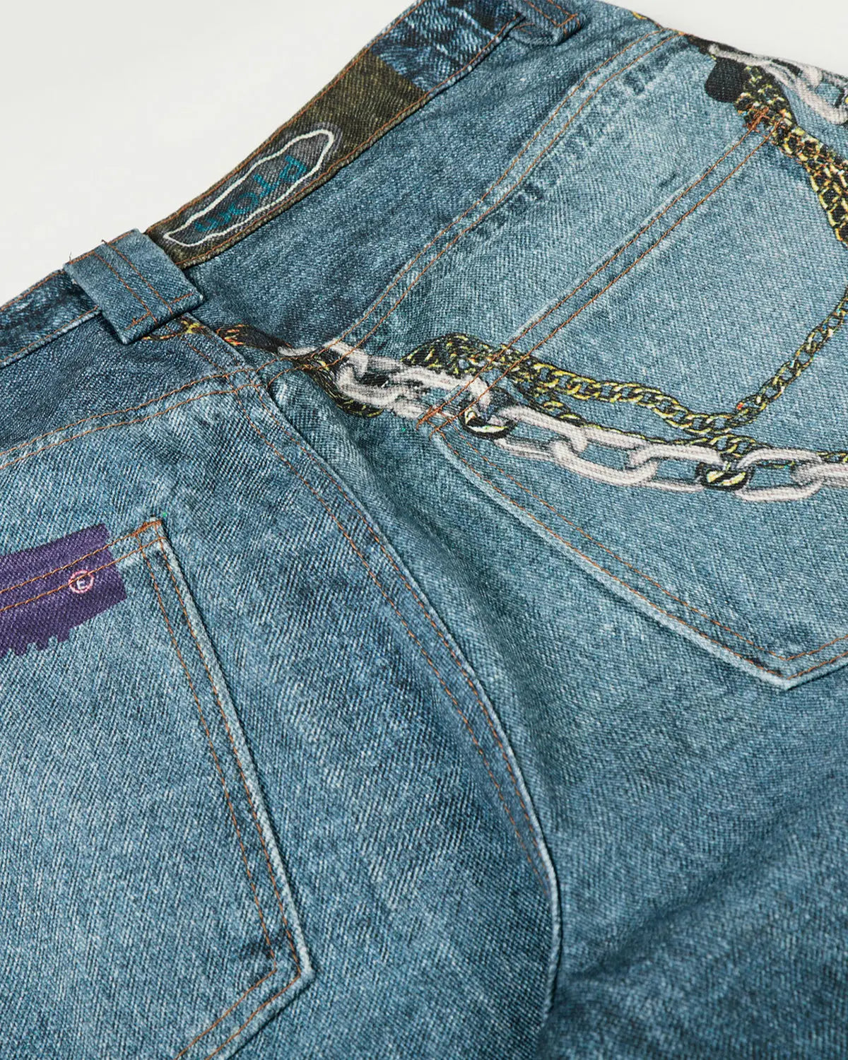 3D print chain barrel jeans by INFLATION featuring detailed chain patterns and streetwear style in denim fabric.